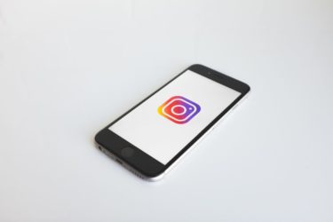 Image of a smart phone with the instagram logo on the screen