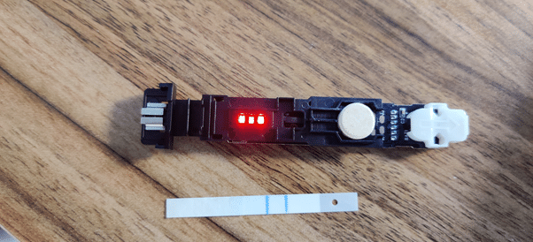 A stripped back digital pregnancy test and the testing paper within it.
Source: https://twitter.com/CrunkComputing/status/1292930670583406592