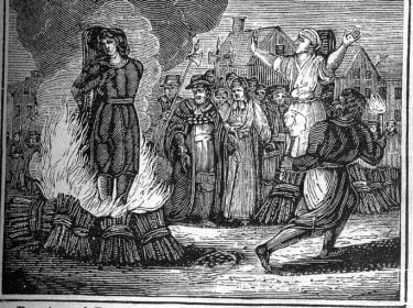 a woodcut illustrating an execution by burning at the stake from a mid 19th Century book