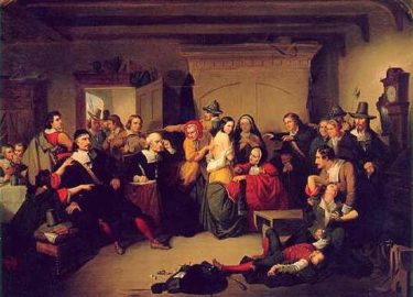 Examination of a Witch by T. H. Matteson. A painting depicting a trial in which many are pointing and shouting while a woman is collapsed into the arms of a man, another man passed out at her feet.