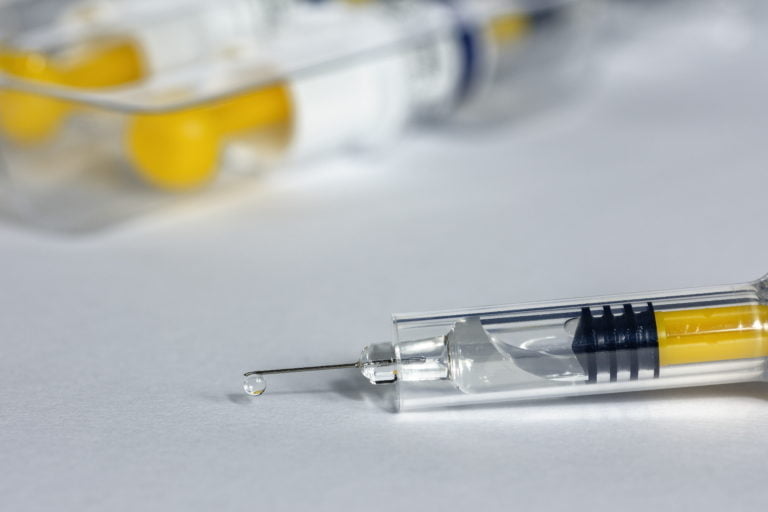 The COVID-19 vaccines are a sign for cautious optimism – but it is still early days