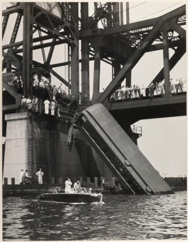 The last carriage of the commuter train dangling from the Newark Bay lift bridge in 1958