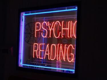Neon sign reading "psychic reading" - photo by author Bohemian Baltimore (CC BY-SA 4.0)