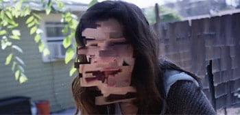 A shot from the trailer of the film. A girlf with a distorted face