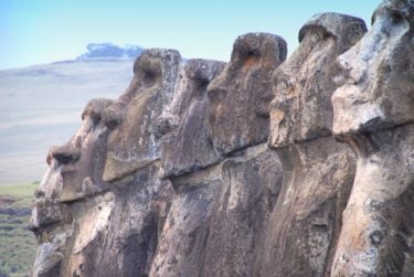 The Moai carvings that were moved from the quarry in which they were made stand side by side on the Island's perimeter. The photo shows 7 of the large carvings stood shoulder to shoulder.