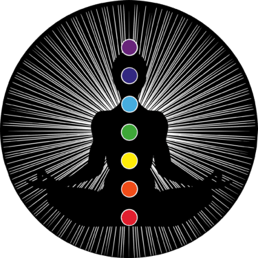 A diagram of chakra;s running through a silhouette of a body. 