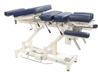 Chiropractic 'drop table' - segments of the table can drop independently, causing a chiropractic adjustment