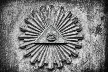 an illuminati symbol in concrete