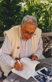 Dr Theodore Mangiapan, former Clinical Director at Lourdes, autographing his book for the author, (23rd September 1995)