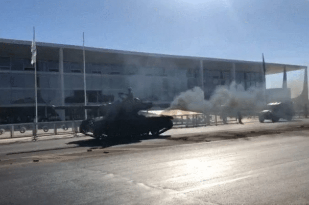 A tank moving through a street