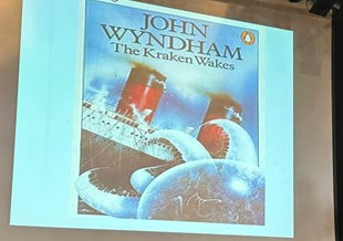A projected slide showing the Penguin cover of John Wyndham's "The Kraken Wakes" featuring a huge octopus-like monster attacking an ocean liner.
Source: Brian Eggo