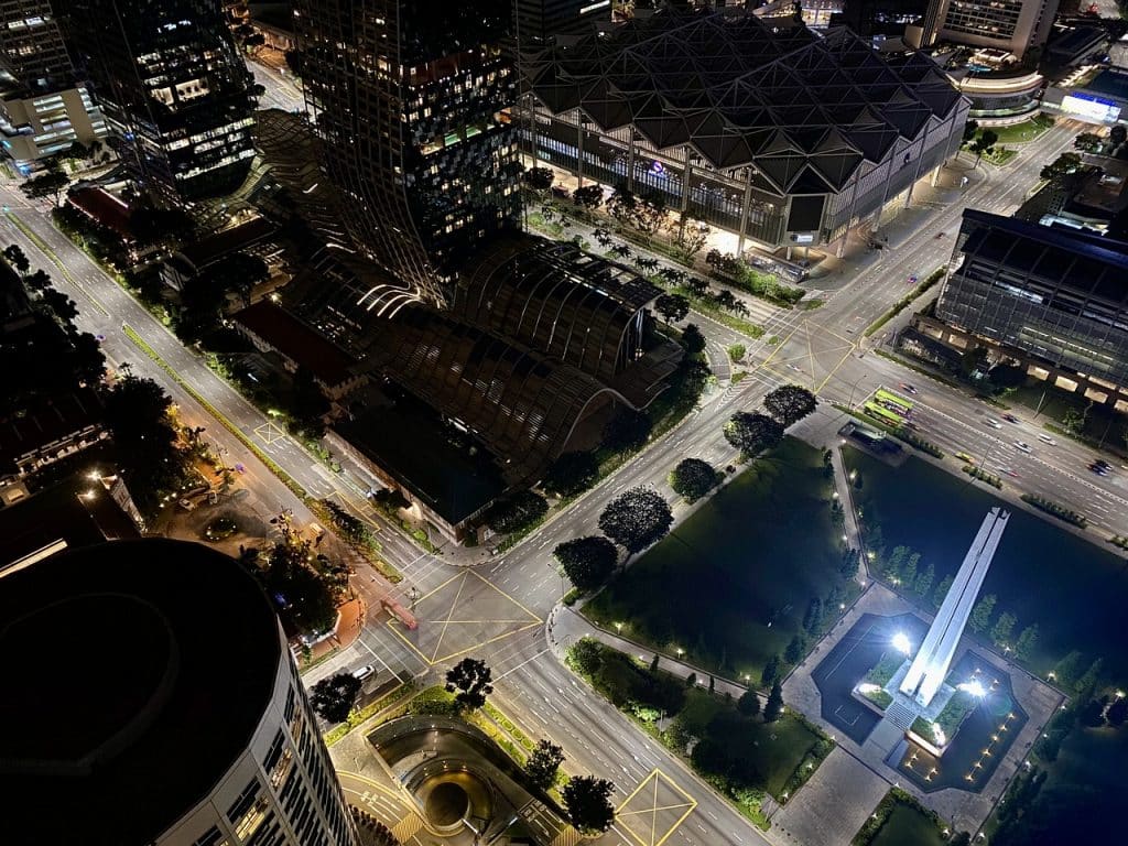 An aerial view of around 4 blocks in Singapore, with the Civilian War Memorial visible in the lower right