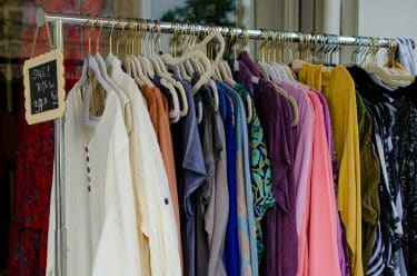 A sale rail in a thrift shop
Photo by Megan Lee on Unsplash
