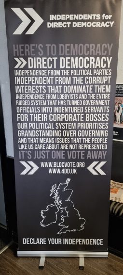 A zip banner titled "Independents for Direct Democracy".

Here's to democracy. Direct democracy. Independence from the political parties. Independent from the corrupt interest that dominate them. Independence from lobbyists and the entire rigged system that has turned government officials into indentured servants for their corporate bosses. Our political system prioritises grandstanding over governing and that means issues that the people like us care about are not represented. It's just one vote away. Declare your independence.
