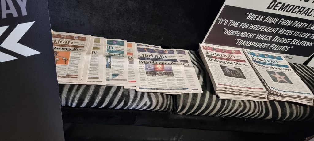 Several issues of The Light newspaper, displayed at the conference.