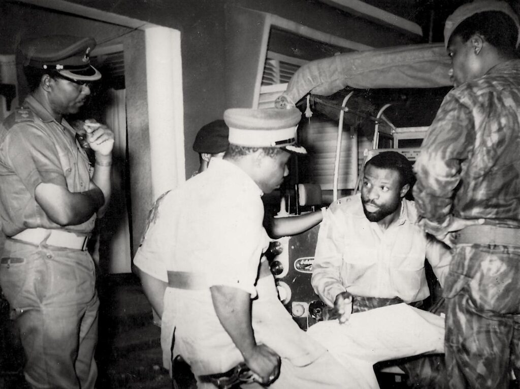 A black and white photo from the late 1960s during the Nigerian civil war showing military men in a briefing
