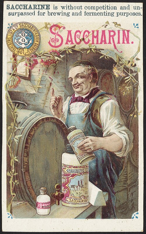 An coloured illustration of a jollly-looking man with his sleeves rolled up and wearing an apron, standing at a work table on which a large barrel. He is holding a colourful bottle, and beside him is a larger similar bottle labelled "Saccharin". Above this scene is the text
"Saccharine is without competition and unsurpassed for brewing and fermenting purposes"