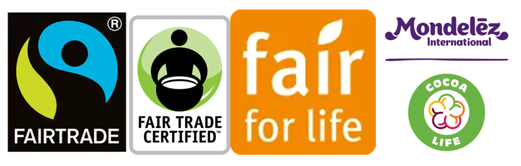 A selection of fair trade logos; FAIRTRADE with the green and blue river/sun-person logo on black, Fair Trade Certified(tm) with a person holding a bowl on a green spherical background, fair trade for life (the i in fair has a leaf for a dot), and Mondelez International's Cocoa Life, the latter having a flower symbol in multicolour on a mostly green circular background.